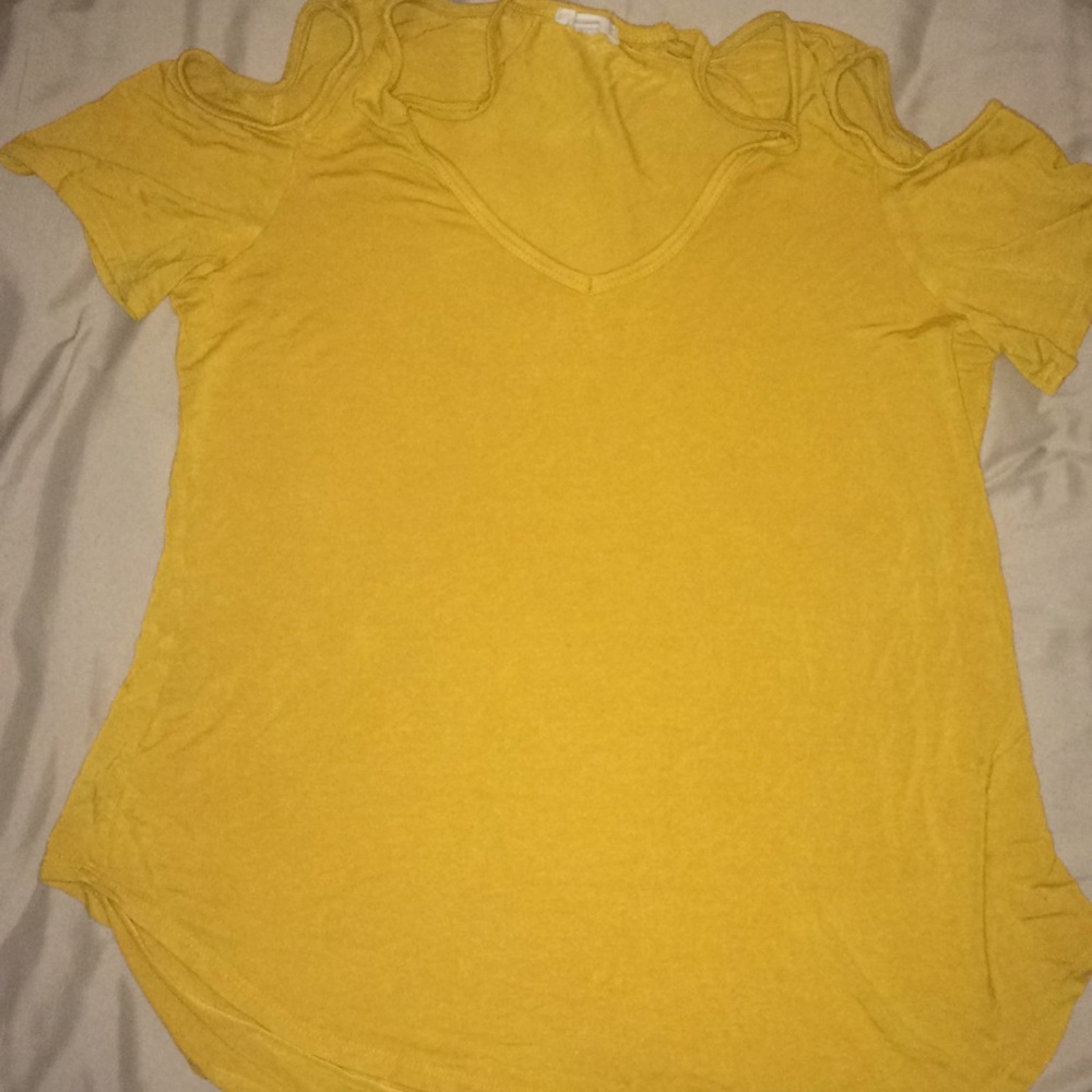Mustard colored shirt with holes on shoulders